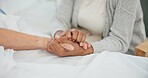 Senior couple, support and holding hands in hospital with love and care at clinic. Elderly patient, kindness and marriage with trust and healthcare with medical help and homecare with empathy