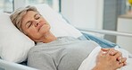 Hospital, sleep and senior woman in bed for recovery, resting and relaxing after surgery treatment. Healthcare, clinic and elderly female person with eyes closed for medical care, service and help