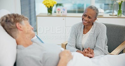Senior women friends, hospital bed and holding hands with conversation, care and support for recovery from surgery. Clinic visit, empathy and elderly lady with smile, chat and listen with solidarity