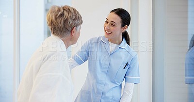 Hospital, talking and senior woman with nurse for medical care, hospice service and support. Healthcare, nursing home and female health worker with elderly patient for conversation, help and empathy