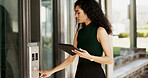 Elevator button, woman typing and business tablet at corporate building and lift for office floor. Company, female person and financial employee working on tech data and planning an online project