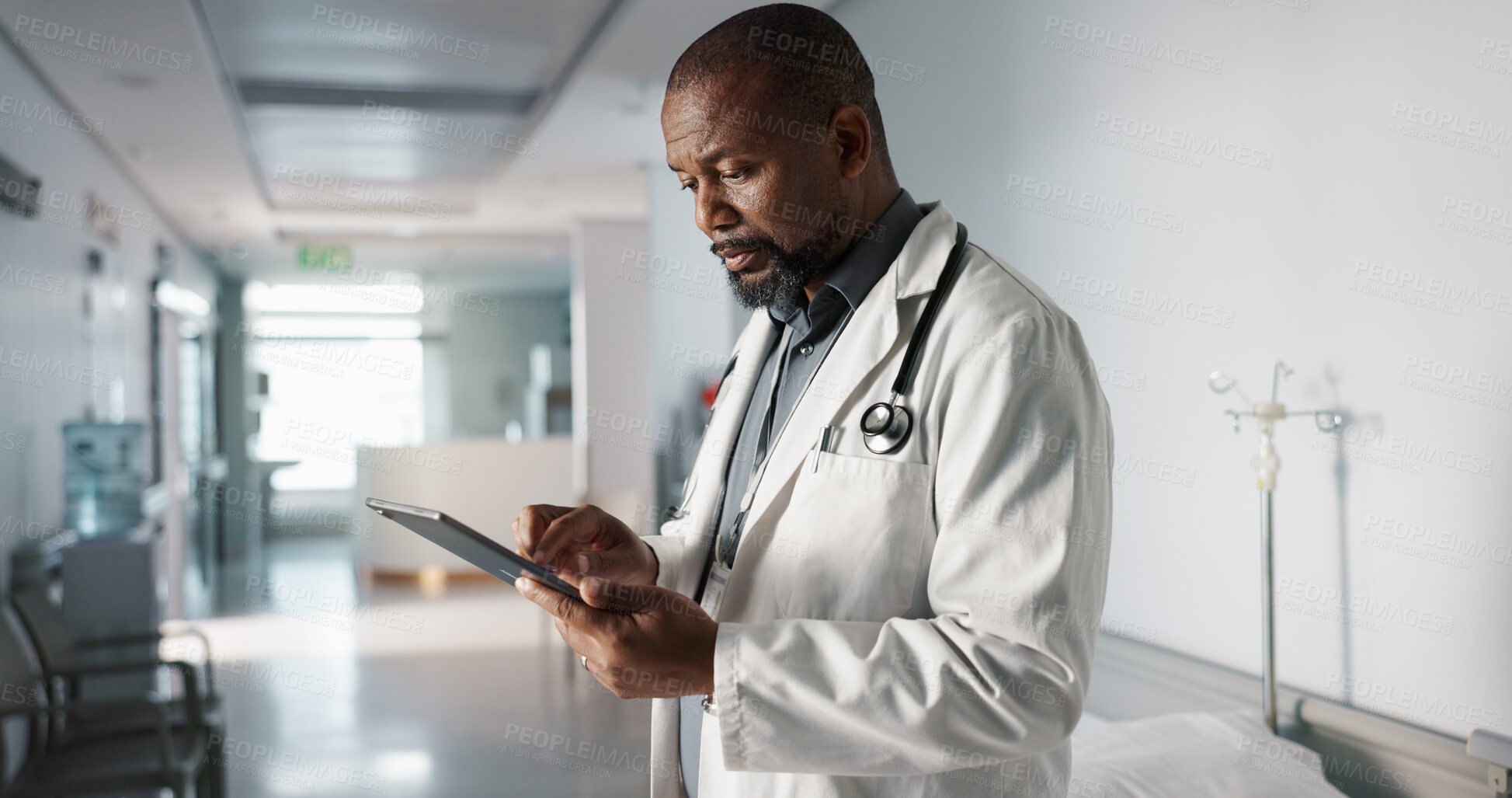 Buy stock photo Doctor, hospital and tablet of healthcare information, typing and management of online charts or results. Healthcare worker or african person smile for service, planning or data on digital technology