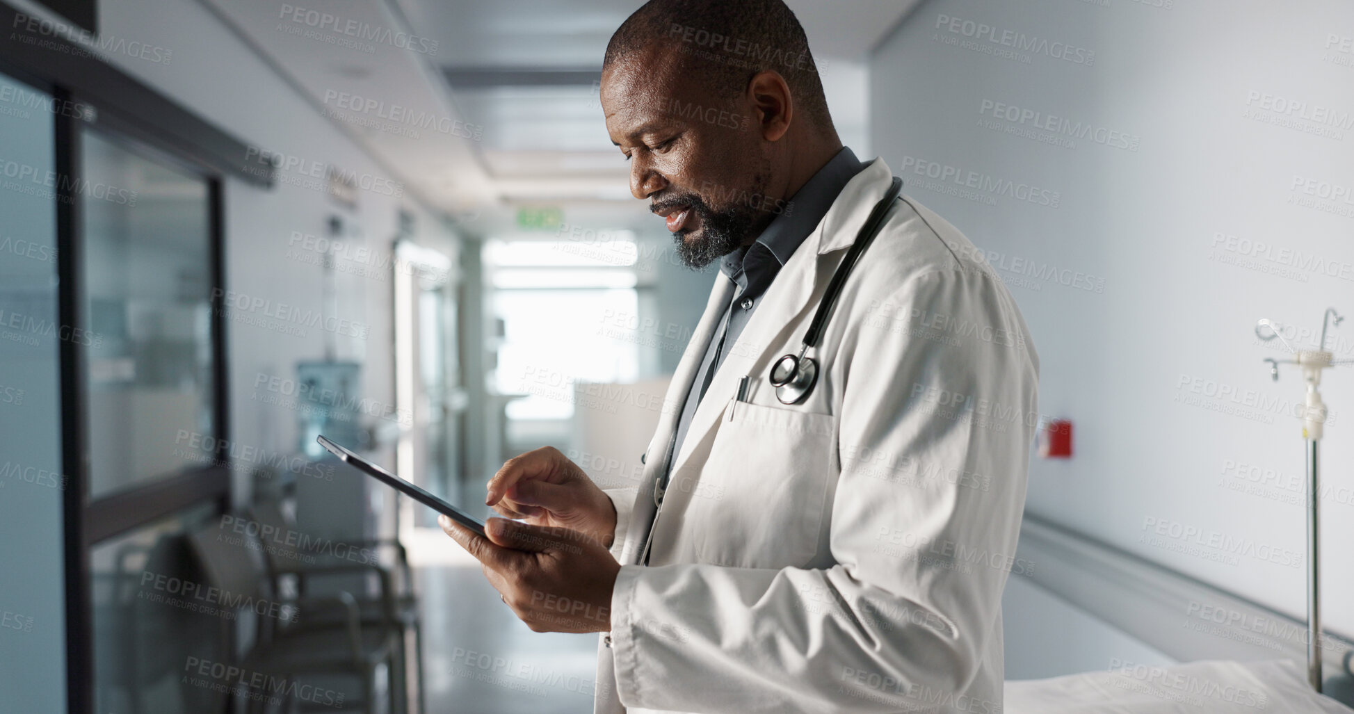 Buy stock photo Doctor, hospital and tablet of healthcare information, typing and management of online charts or results. Healthcare worker or african person smile for service, planning or data on digital technology