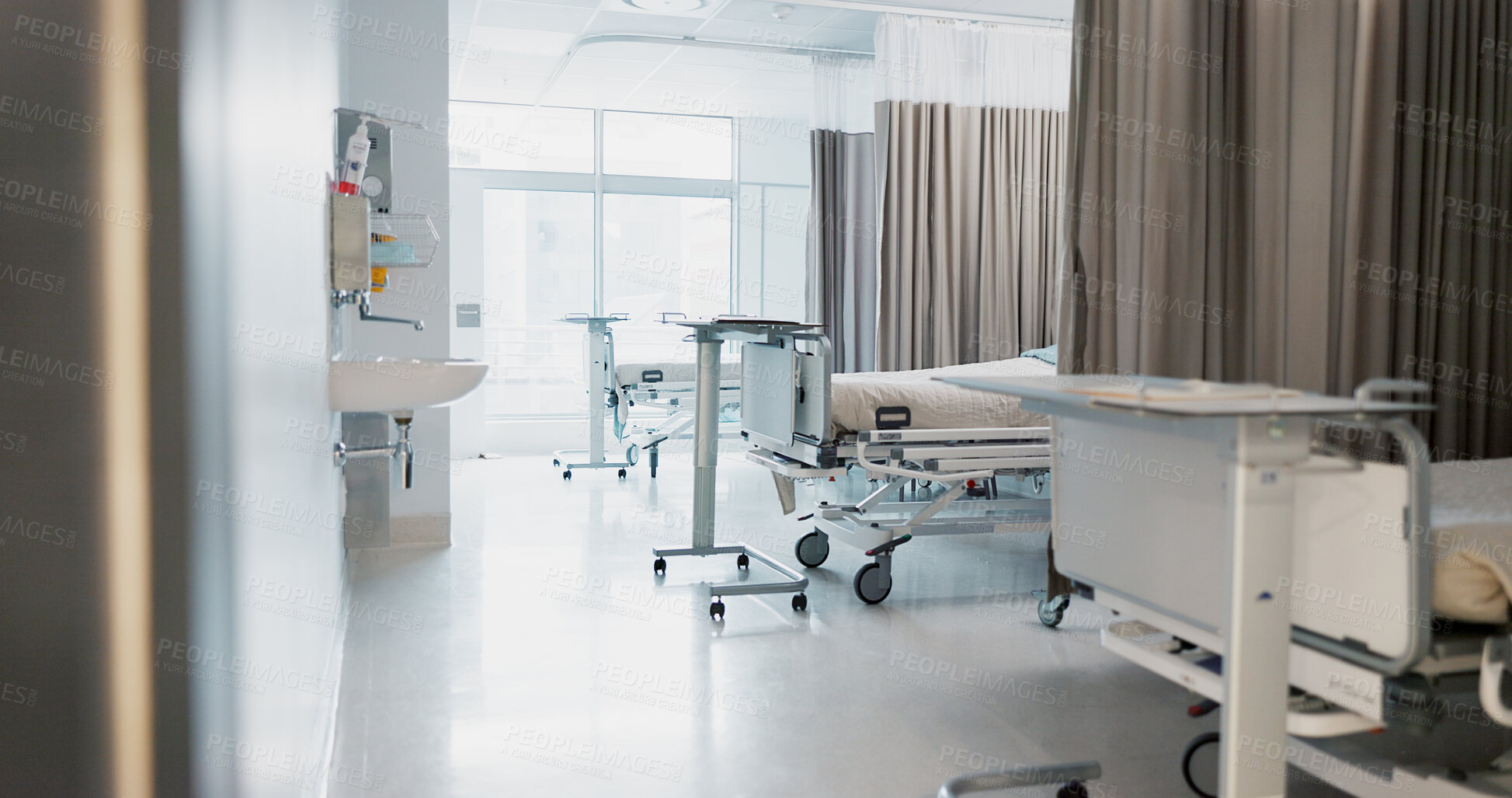 Buy stock photo Hospital, modern and interior of bedroom or empty room for healthcare, consulting or healing. Background, medical and clinic space for emergency, rehabilitation or recovery with furniture or light