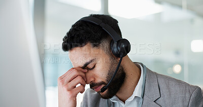 Stress, headache and man in call center, tired and fatigue at help desk in office. Burnout, anxiety and sales agent in telemarketing frustrated with customer crisis, work mistake and fail challenge