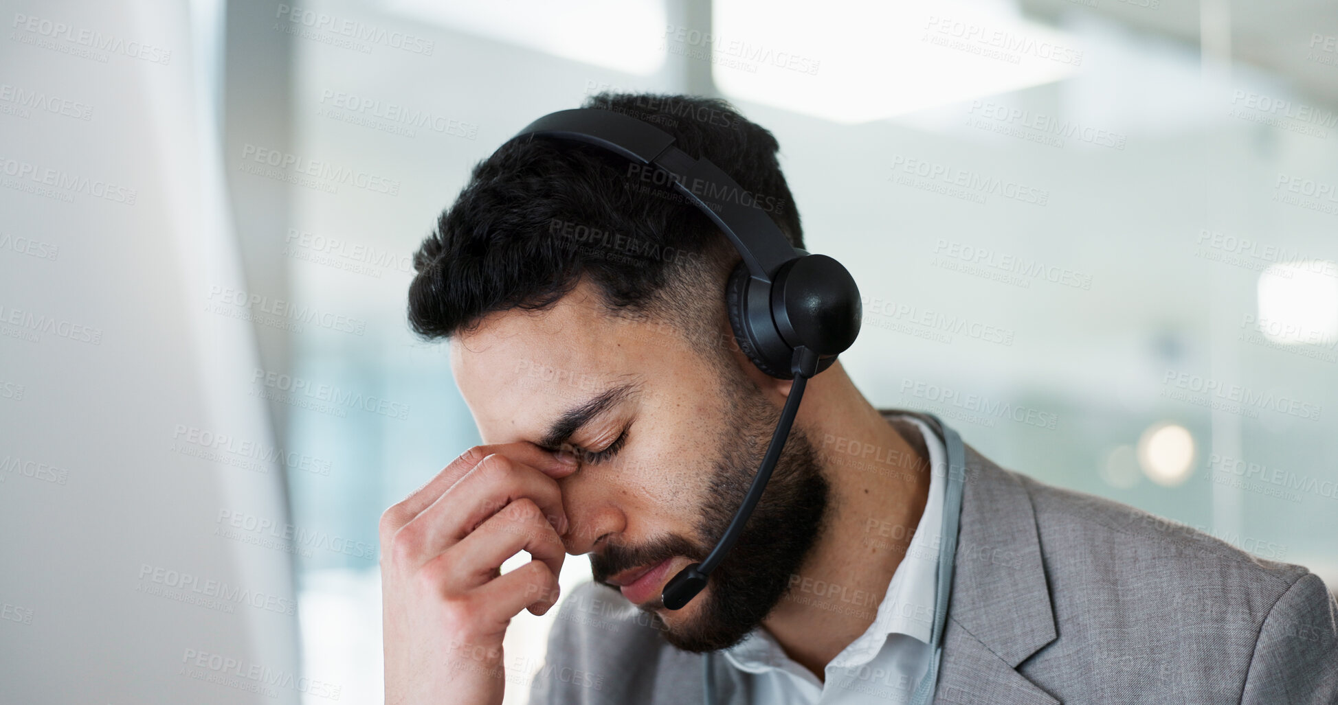 Buy stock photo Stress, headache and man in call center, tired and fatigue at help desk in office. Burnout, anxiety and sales agent in telemarketing frustrated with customer crisis, work mistake and fail challenge