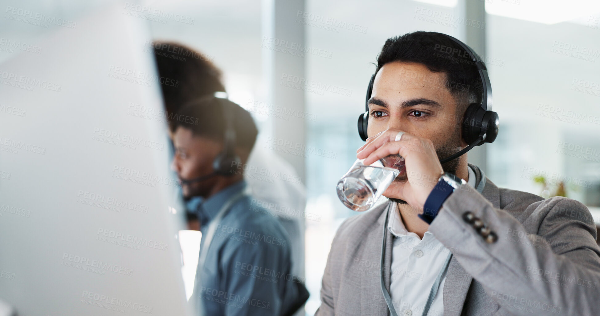 Buy stock photo Happy businessman, call center and drinking water in customer service or telemarketing at office. Thirsty man, consultant or agent talking with headphones and drink for online advice, support or help