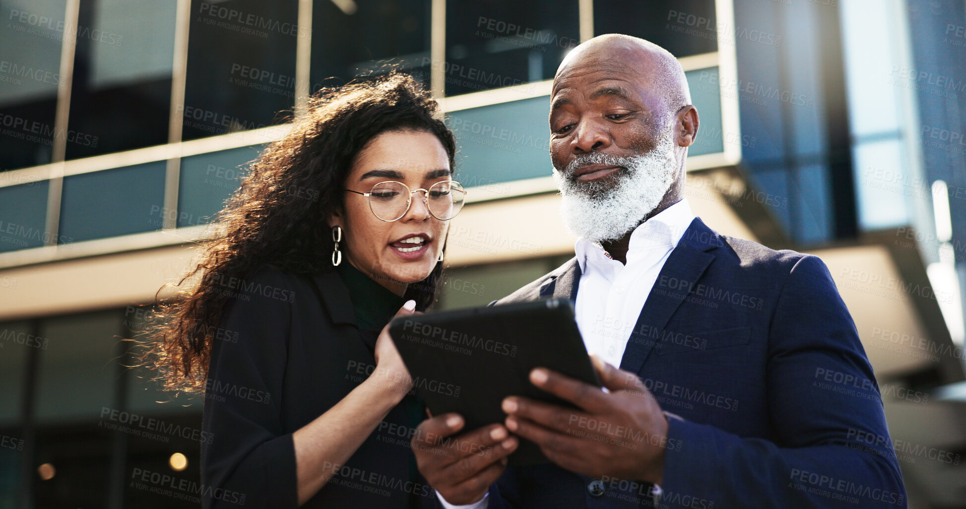 Buy stock photo Tablet, talking and businesswoman with manager in the city planning a legal strategy. Discussion, digital technology and team of professional lawyers working on case in collaboration in urban town.