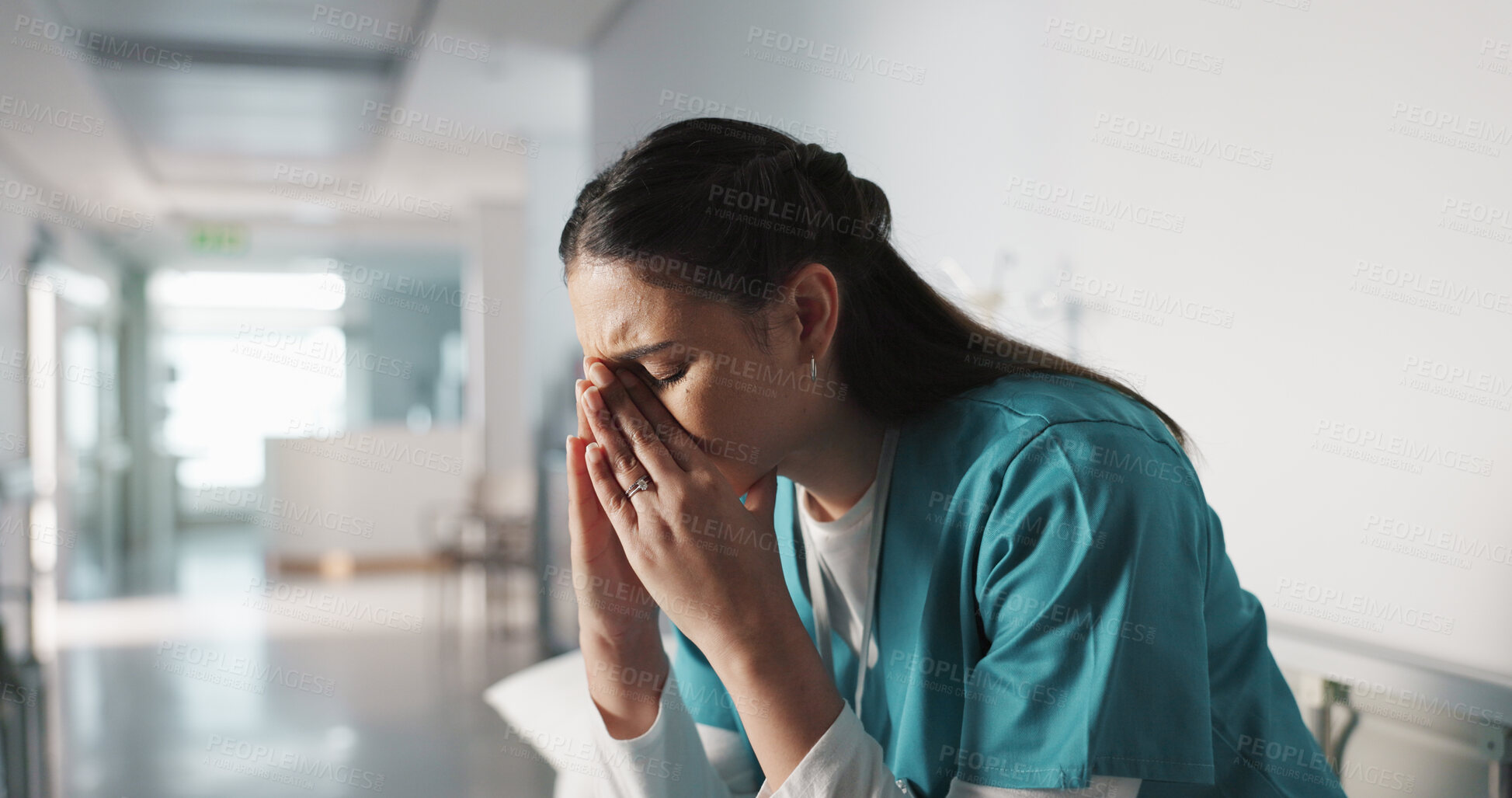 Buy stock photo Stress, sad and loss with a woman nurse in hospital after a fail, mistake or error in healthcare treatment. Depression, anxiety and grief with a young medicine professional in a medical clinic