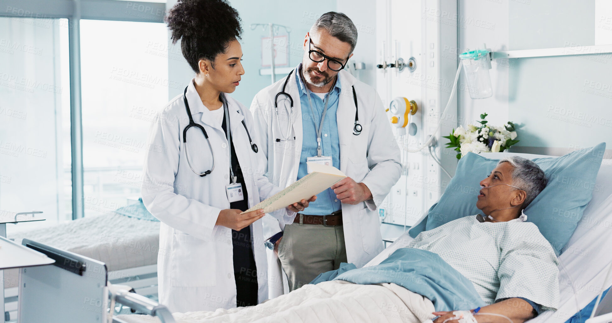 Buy stock photo Healthcare, documents and a medical team of doctors checking on a patient in recovery or rehabilitation. Medicine, teamwork and explain with a group of health professionals in a hospital for wellness