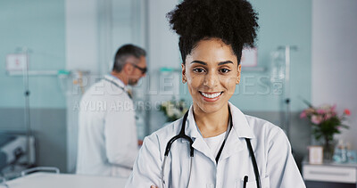 Hospital, doctor and face of woman with crossed arms for medical service, care and insurance. Healthcare, professional and portrait of person smile for consulting, medicine and medicare in clinic
