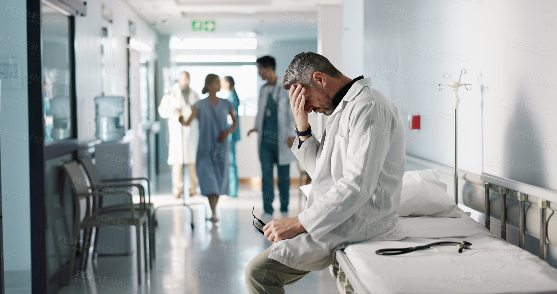 Buy stock photo Depression, grief or fail with a mature doctor in a hospital looking unhappy for healthcare or medical. Stress, mistake or loss with a sad man medicine professional in a professional medicare clinic