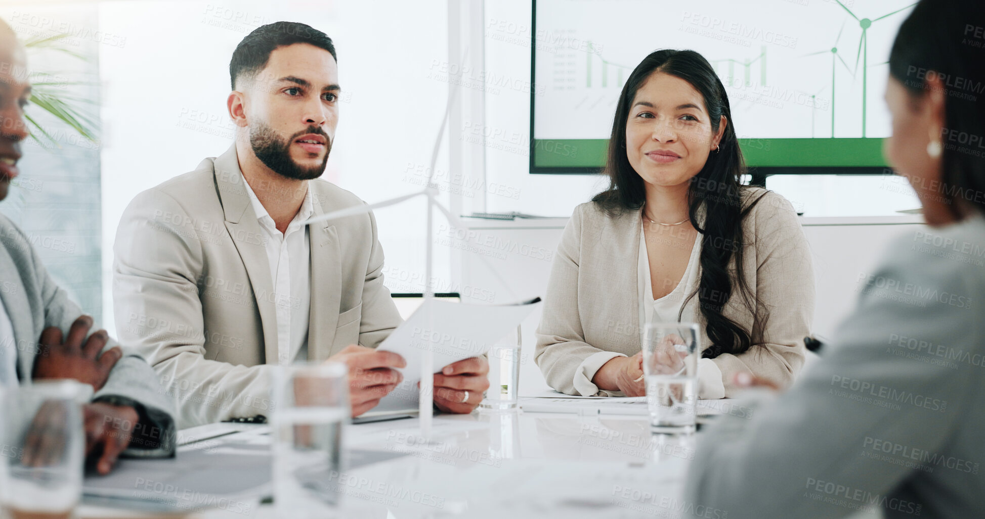 Buy stock photo Business people, renewable energy and windmill in team discussion or meeting for proposal or planning. Diversity, future or men and women talk technology development, collaboration and innovation