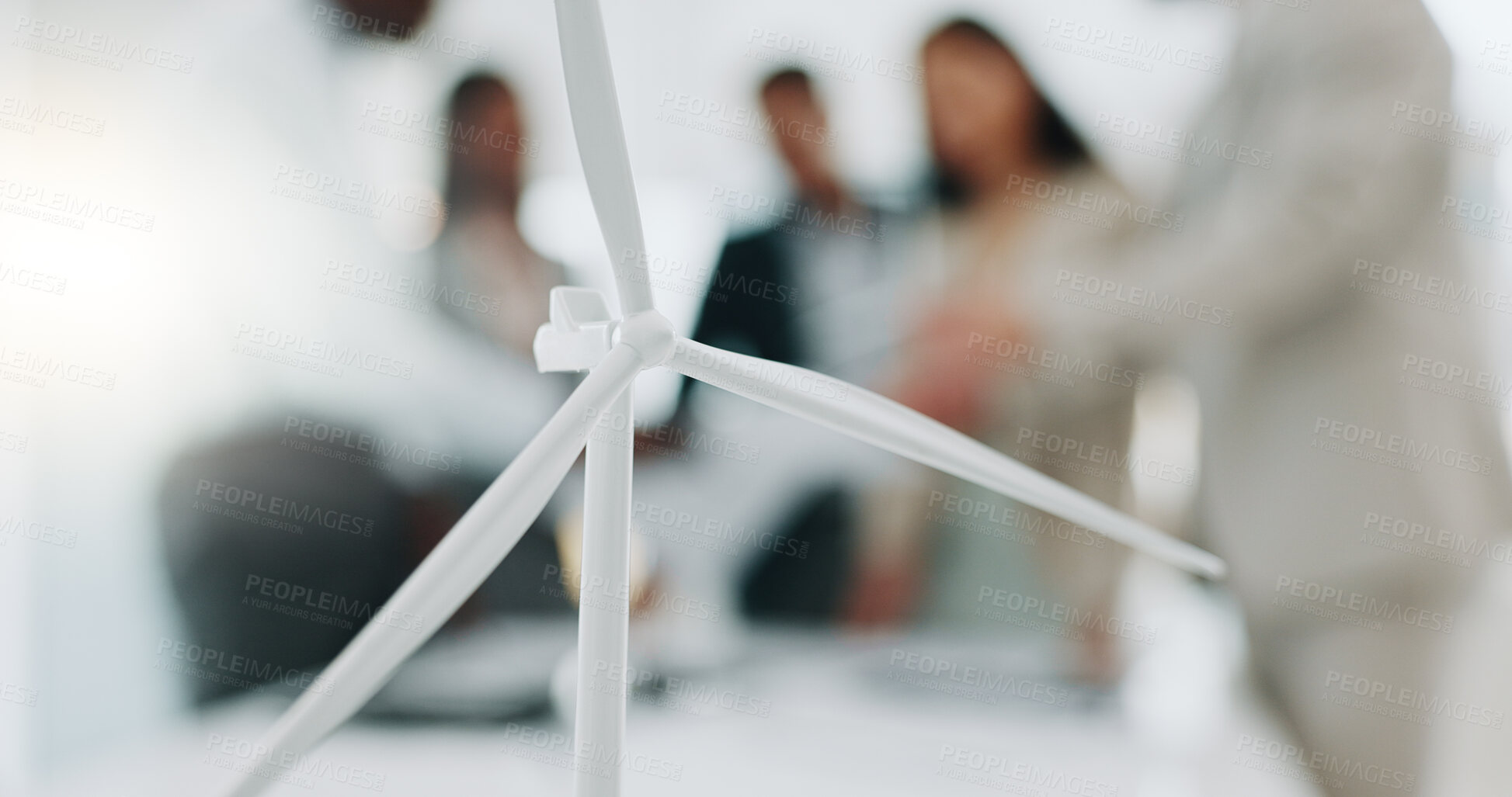 Buy stock photo Business people, meeting and wind turbine for eco friendly, sustainability and renewable energy planning in office. Windmill model, design and engineering team with documents in agriculture solution