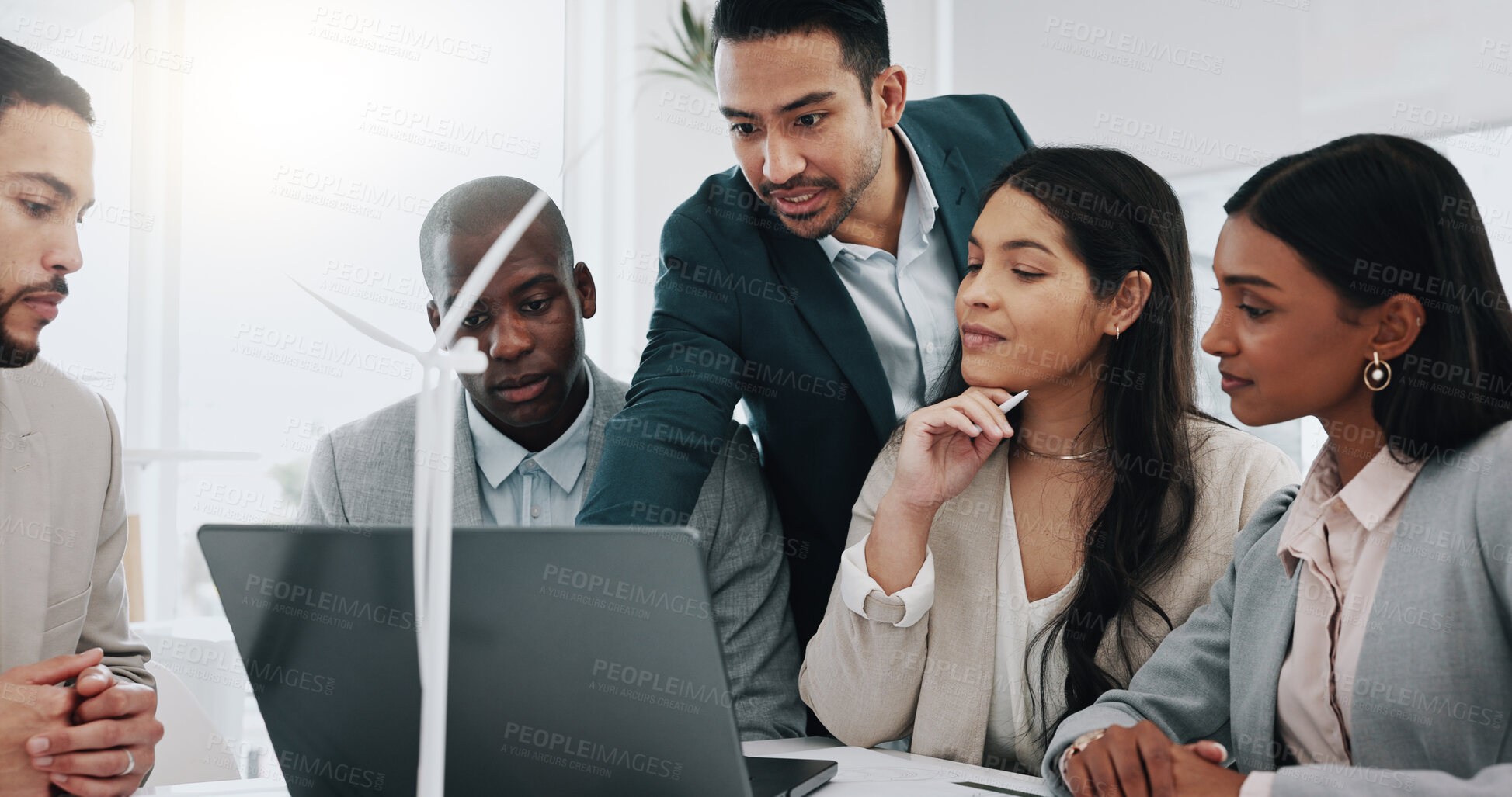 Buy stock photo Wind turbine, computer and man in office team working on clean energy and sustainability planning. Engineering, construction project and architect job with eco friendly and biodiversity design