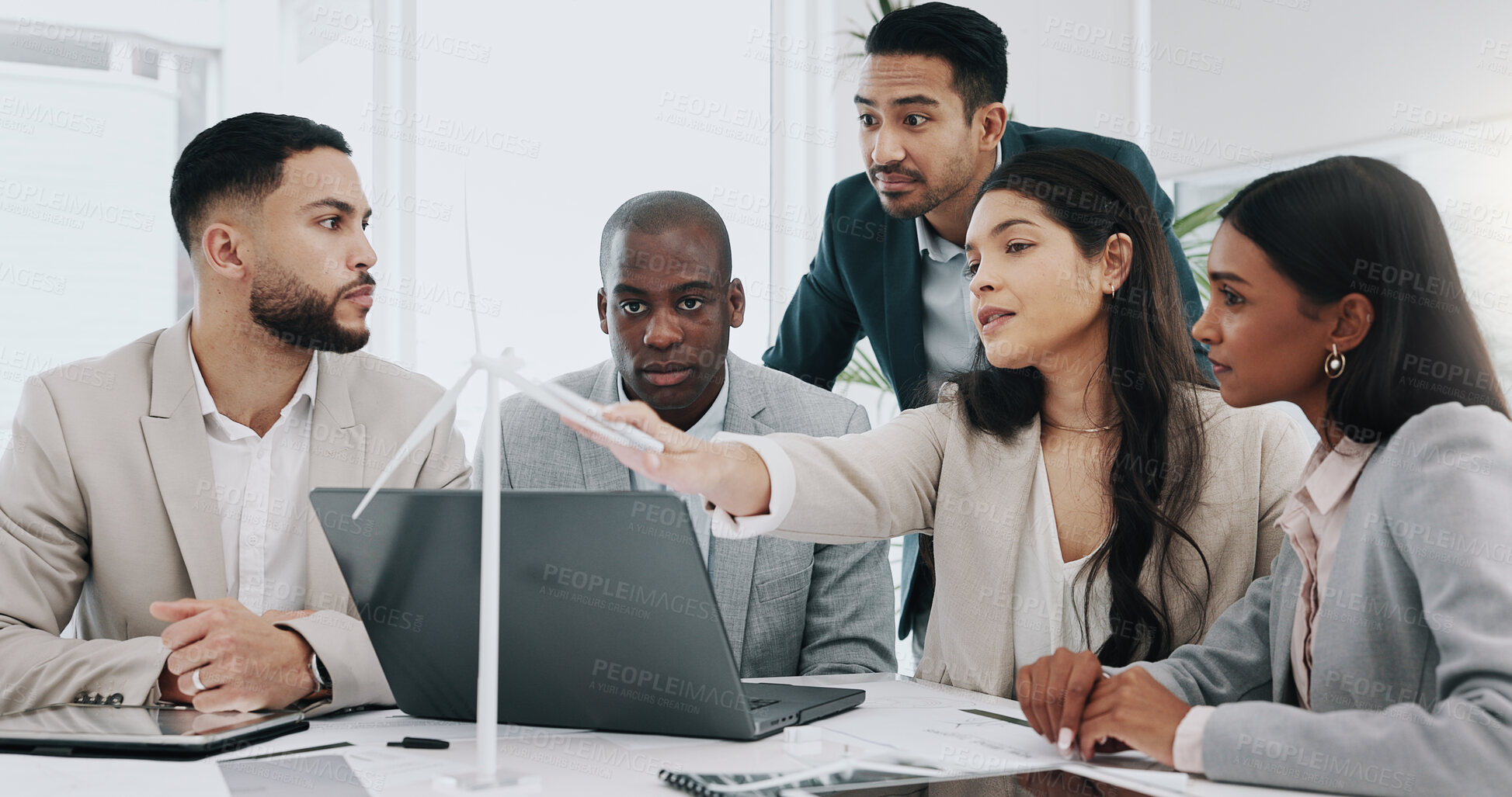 Buy stock photo Wind turbine, computer and man in office team working on clean energy and sustainability planning. Engineering, construction project and architect job with eco friendly and biodiversity design