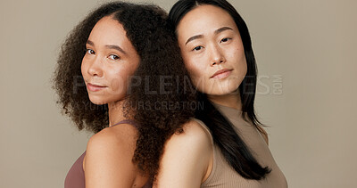 Women, friends and face for skincare, beauty or cosmetics with diversity on a brown studio background. Young model or people in portrait together for skin care, dermatology health and natural makeup