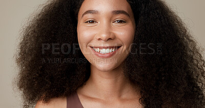 Buy stock photo Beauty, haircare and smile with face of woman in studio for skincare, cosmetics or self care. Happy, hairstyle and natural with portrait of person on brown background for texture, health or wellness