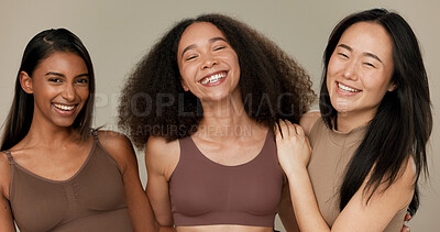 Diversity, underwear and portrait of women friends in studio for beauty, inclusion or wellness. Happy people hug on neutral background as different body care, skin glow or natural cosmetic comparison