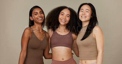 Diversity, underwear and portrait of women friends in studio for beauty, inclusion or wellness. Happy people hug on neutral background as different body care, skin glow or natural cosmetic comparison