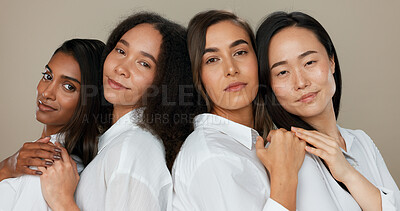 Women, face and skincare, group diversity with love, support and happy friends in portrait for cosmetics on a studio background. Young people smile together and hug for dermatology, beauty and makeup