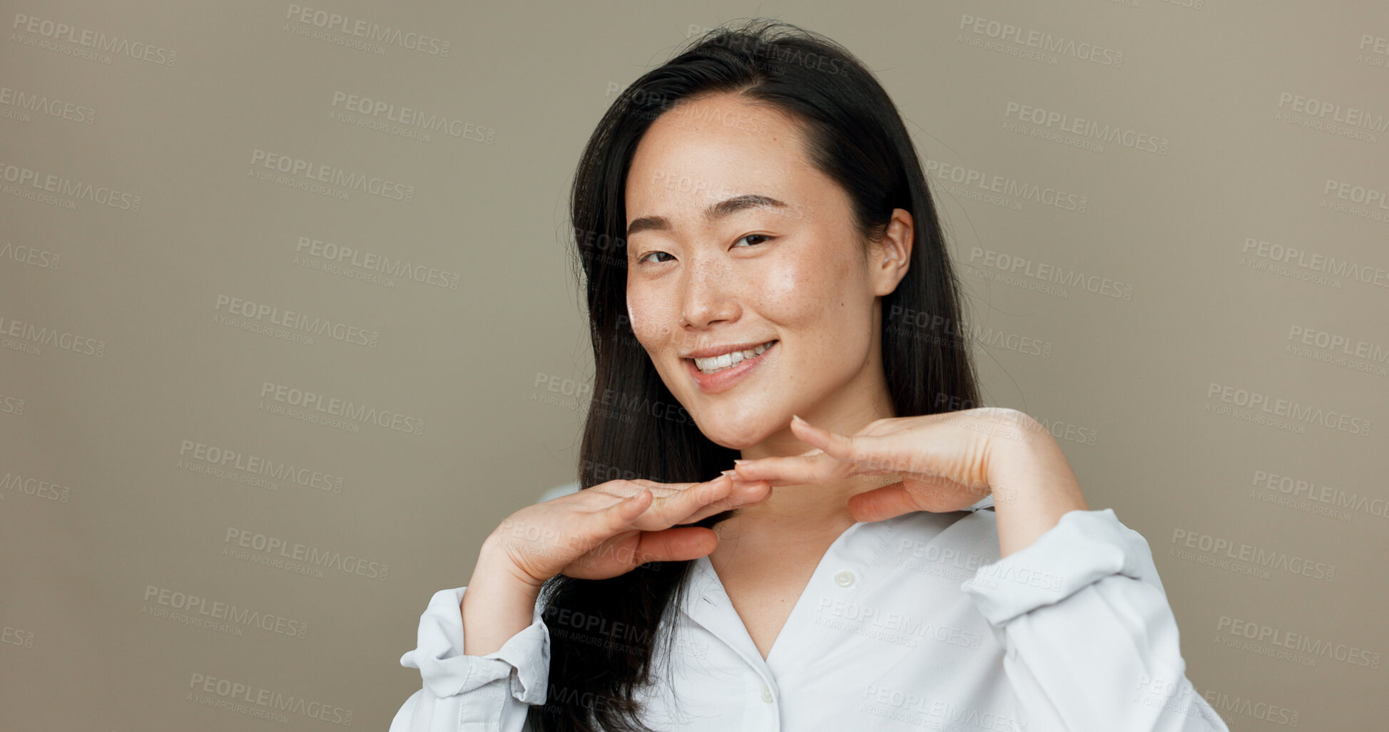 Buy stock photo Woman, smile and beauty with skincare, happy glow and makeup or hair care on studio mockup. Asian, person or model wellness, portrait and cosmetics for dermatology or health on grey background