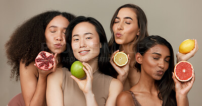Women, portrait and beauty, diversity and fruit with dermatology and friends on studio background. Unique skin, natural cosmetics and inclusion, eco friendly skincare, smile and citrus for vitamin c