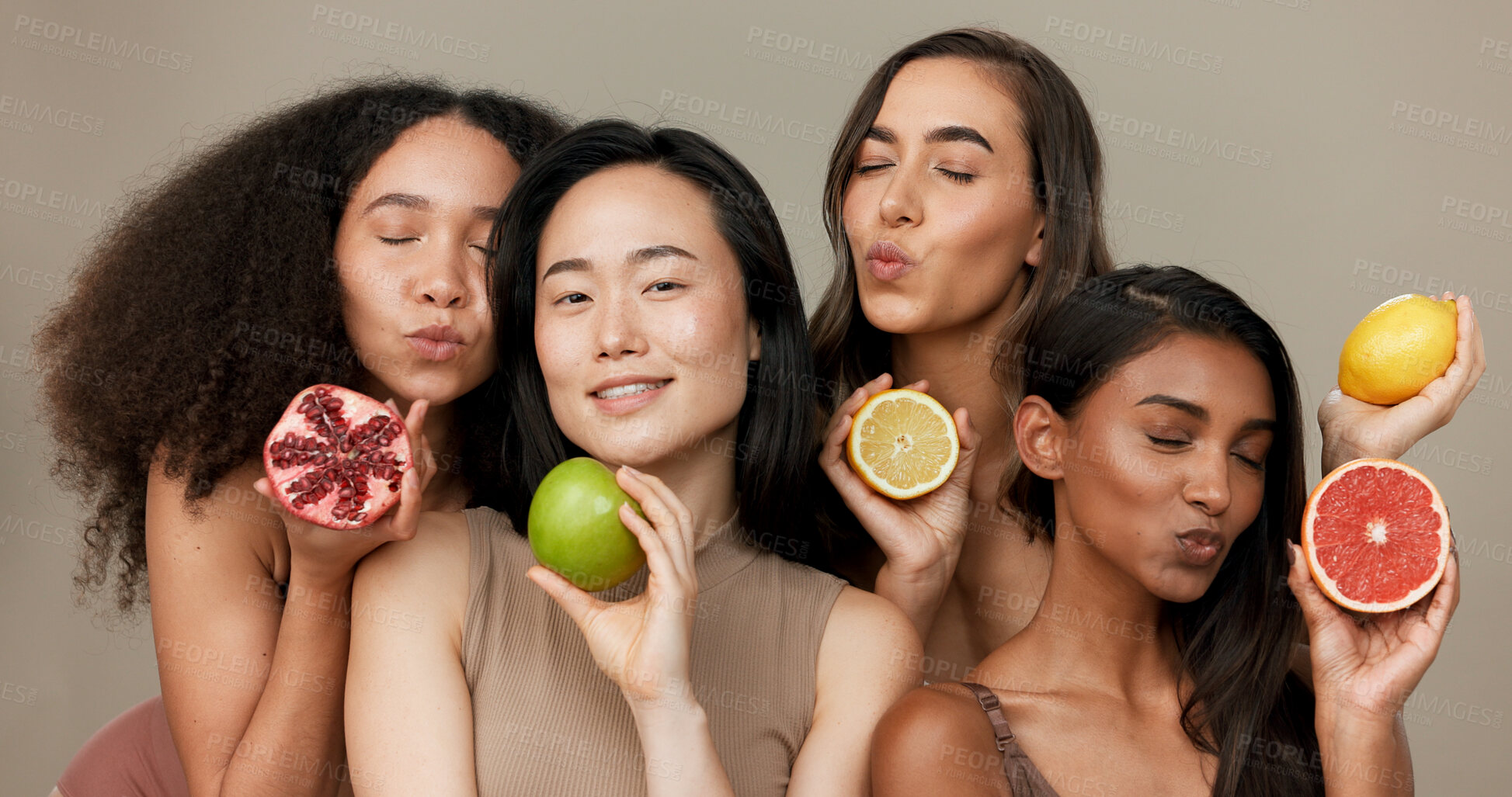 Buy stock photo Women, portrait and beauty, diversity and fruit with dermatology and friends on studio background. Unique skin, natural cosmetics and inclusion, eco friendly skincare, smile and citrus for vitamin c