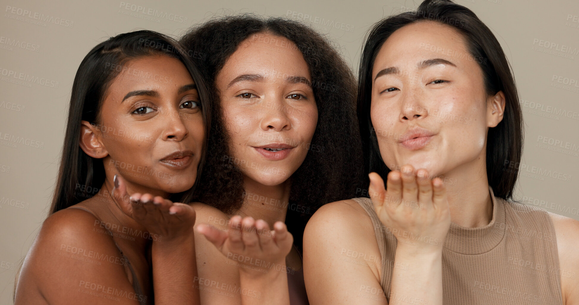 Buy stock photo Beauty, women or friends blow kiss in studio for diversity, inclusion and wellness. Face of happy people on neutral background for different facial care, dermatology glow or makeup and cosmetics