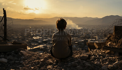 Portrait of child looking over destroyed town. Alone with back to camera.