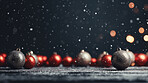 Red, gold noel on table against blue background. Golden bokeh. Christmas concept.