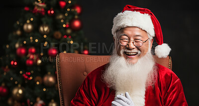 Close up portrait of happy, asian santa.Christmas tree in back. Christmas concept.
