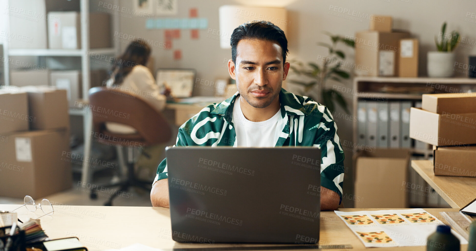 Buy stock photo Ecommerce, man and reading on laptop in office for research, feedback and supply chain for business. Asian, person and planning on pc for logistics, stock administration or package distribution data
