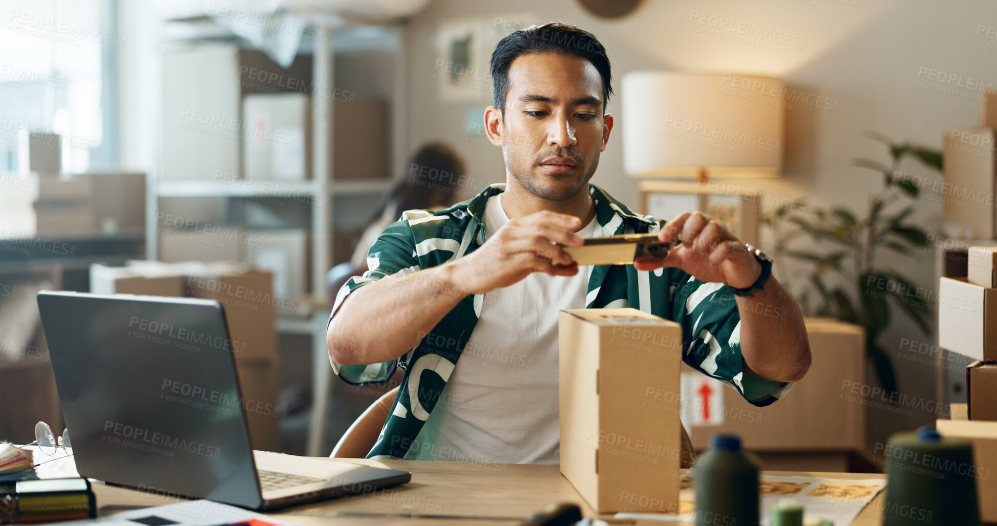 Buy stock photo Asian man, phone and box in logistics or small business for inventory inspection or pricing for ecommerce. Male person or store owner with mobile smartphone, laptop and boxes for picture scan