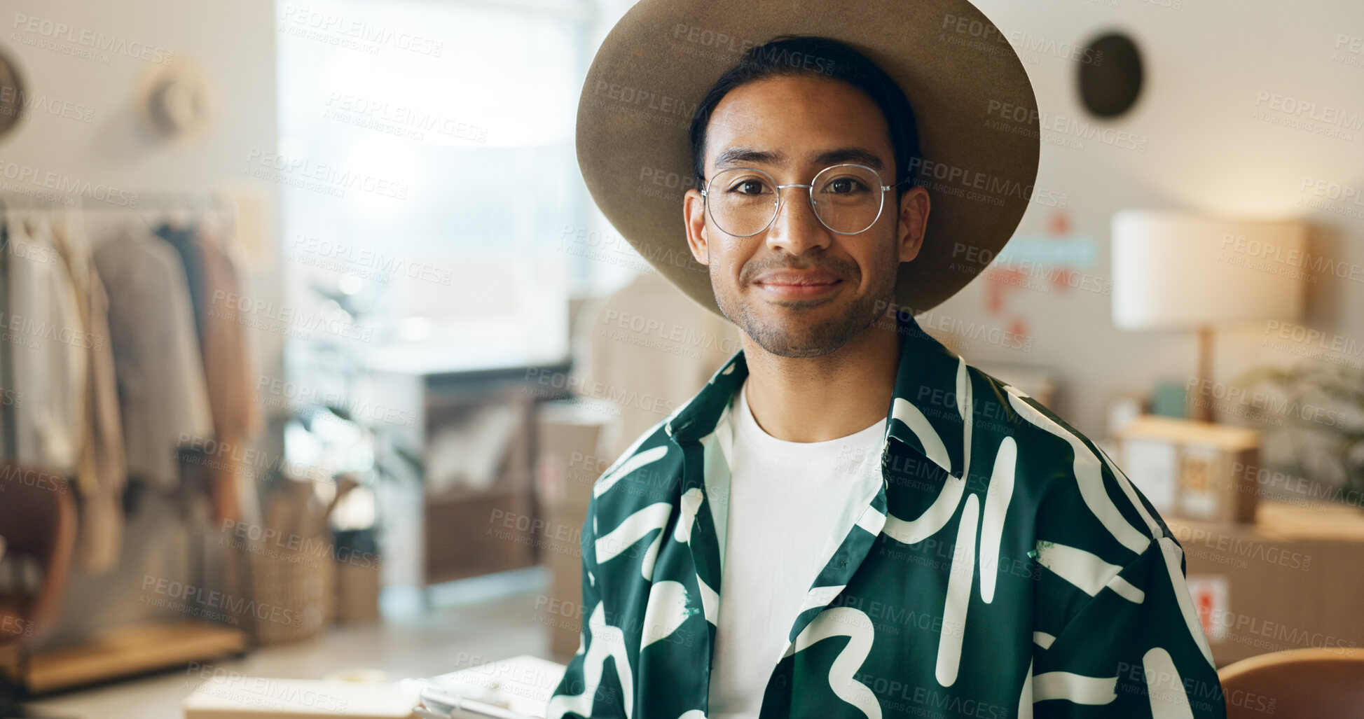 Buy stock photo Happy, fashion and portrait of a man in retail for store management, ecommerce or designer work. Smile, mockup and an Asian employee at a distribution shop for clothes, sale or logistics of stock