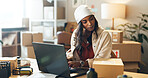 Woman, laptop and small business in logistics with box for order, ecommerce or pricing at boutique. female person or fashion designer on computer for inventory, storage or inspection at retail store