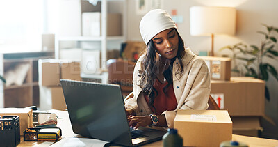 Buy stock photo Woman, laptop and small business in logistics with box for order, ecommerce or pricing at boutique. Female person or fashion designer on computer for inventory, storage or inspection at retail store