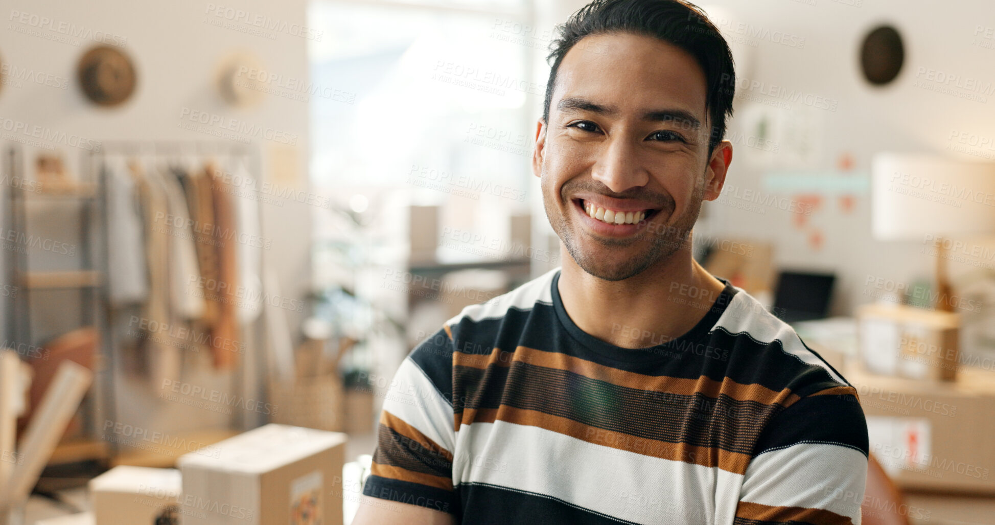 Buy stock photo Portrait, happy and a designer man in his workshop for supply chain logistics, shipping or delivery. Face, smile and a young creative employee in a small business office for distribution or import