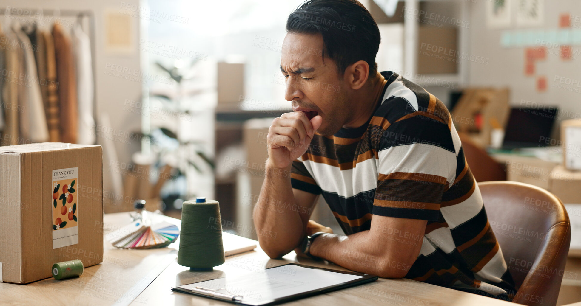 Buy stock photo Fatigue, man and yawning with shipping company, delivery worker at desk with brain fog, small business and clipboard. Overworked, overtime and burnout with inventory or product checklist and tired