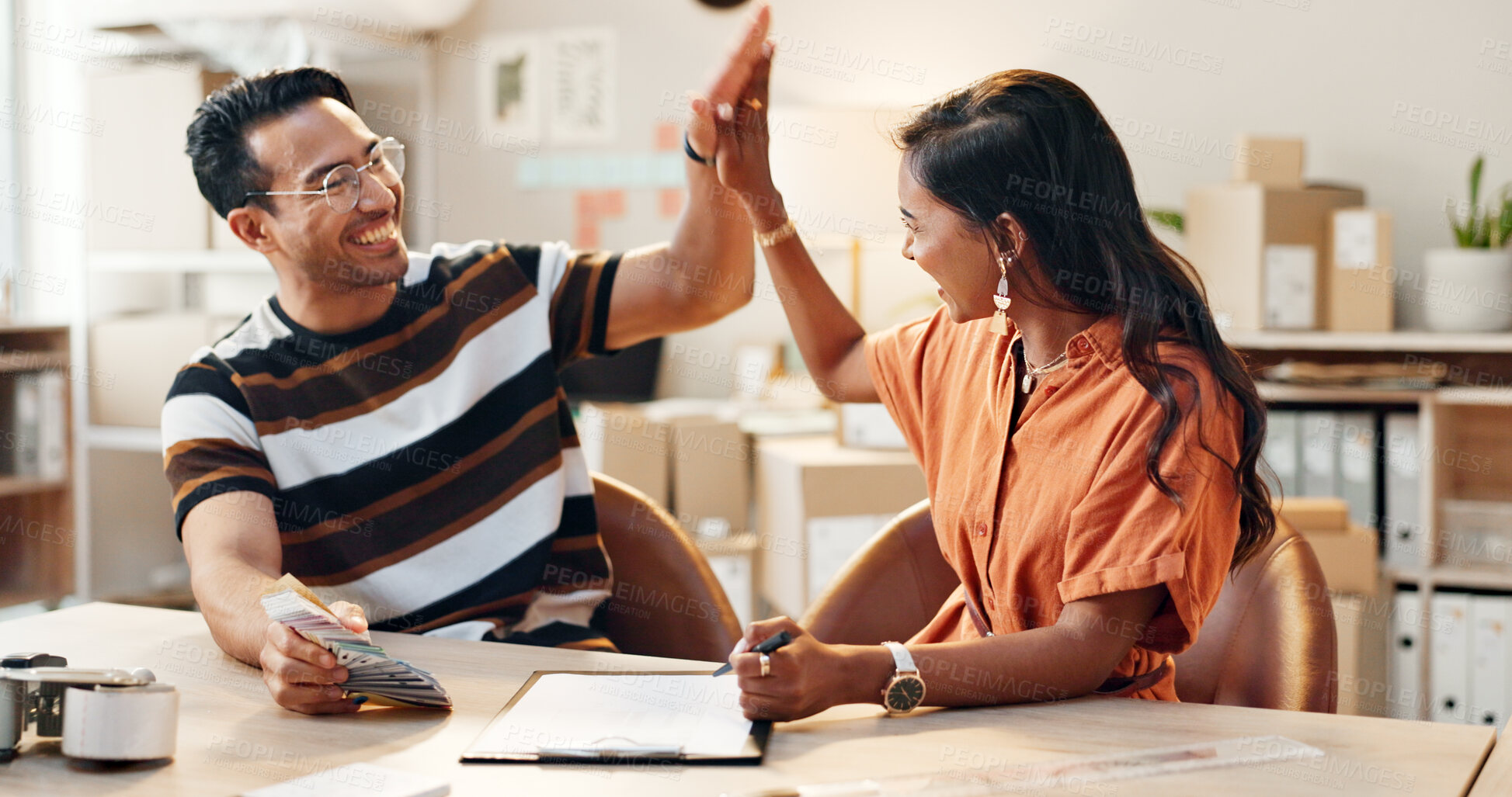 Buy stock photo Happy people, high five and teamwork for design, success or sale with color swatches at store. Excited man and woman touching hands with smile for team promotion, winning or collaboration at workshop