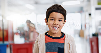 Young student, classroom and happy portrait for education, kindergarten and kid learning with toys. Boy child, face or smile at academy to study, development and excited for school and scholarship