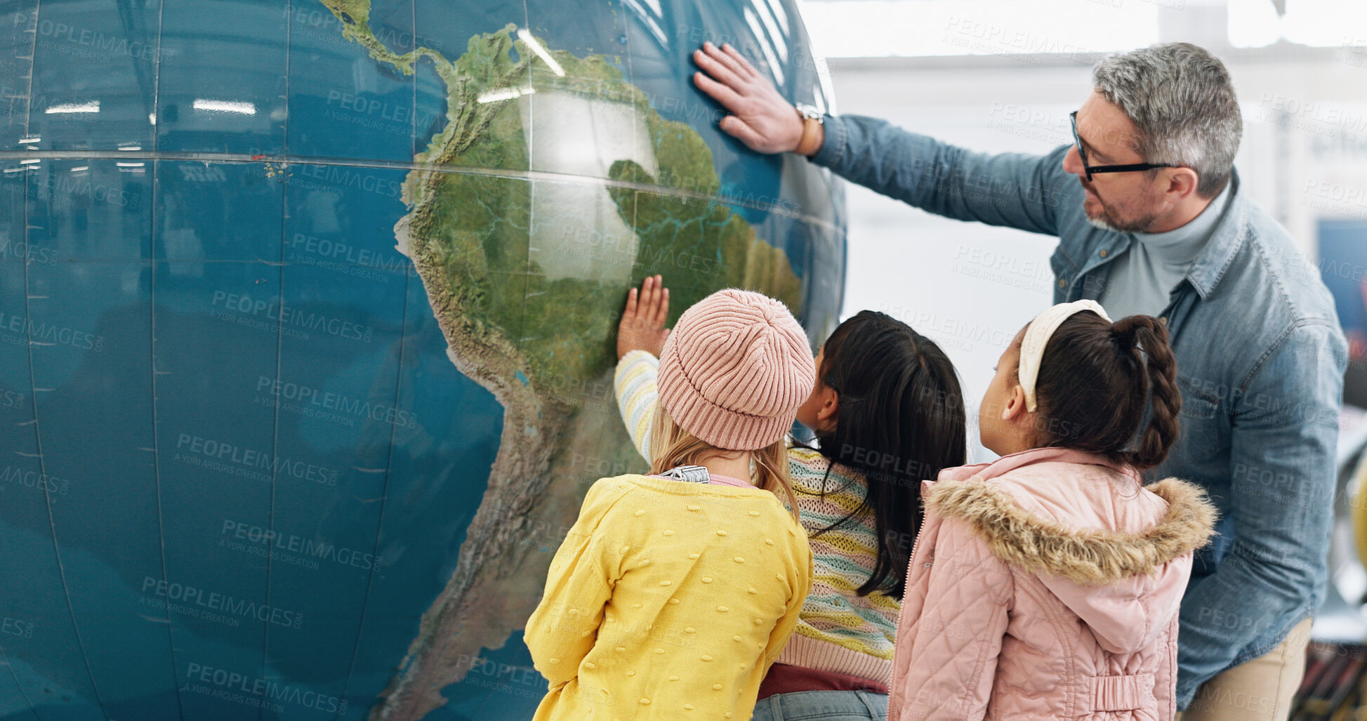 Buy stock photo Science, world and students learning about the earth with a teacher at school for growth or development. Geography, globe or planet with a man teaching kids about climate change or global warming