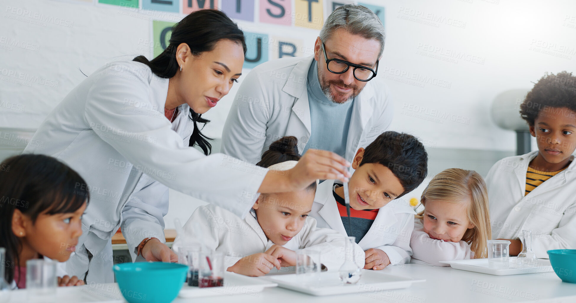 Buy stock photo Science, experiment and students in class with their teachers for learning or to study chemistry. Children, school and education with kids in a laboratory for discovery of a chemical reaction