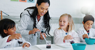 Science, education and children in a classroom with their teacher for learning or to study chemistry. Kids, school and scholarship with students in lab class for an experiment of chemical reaction