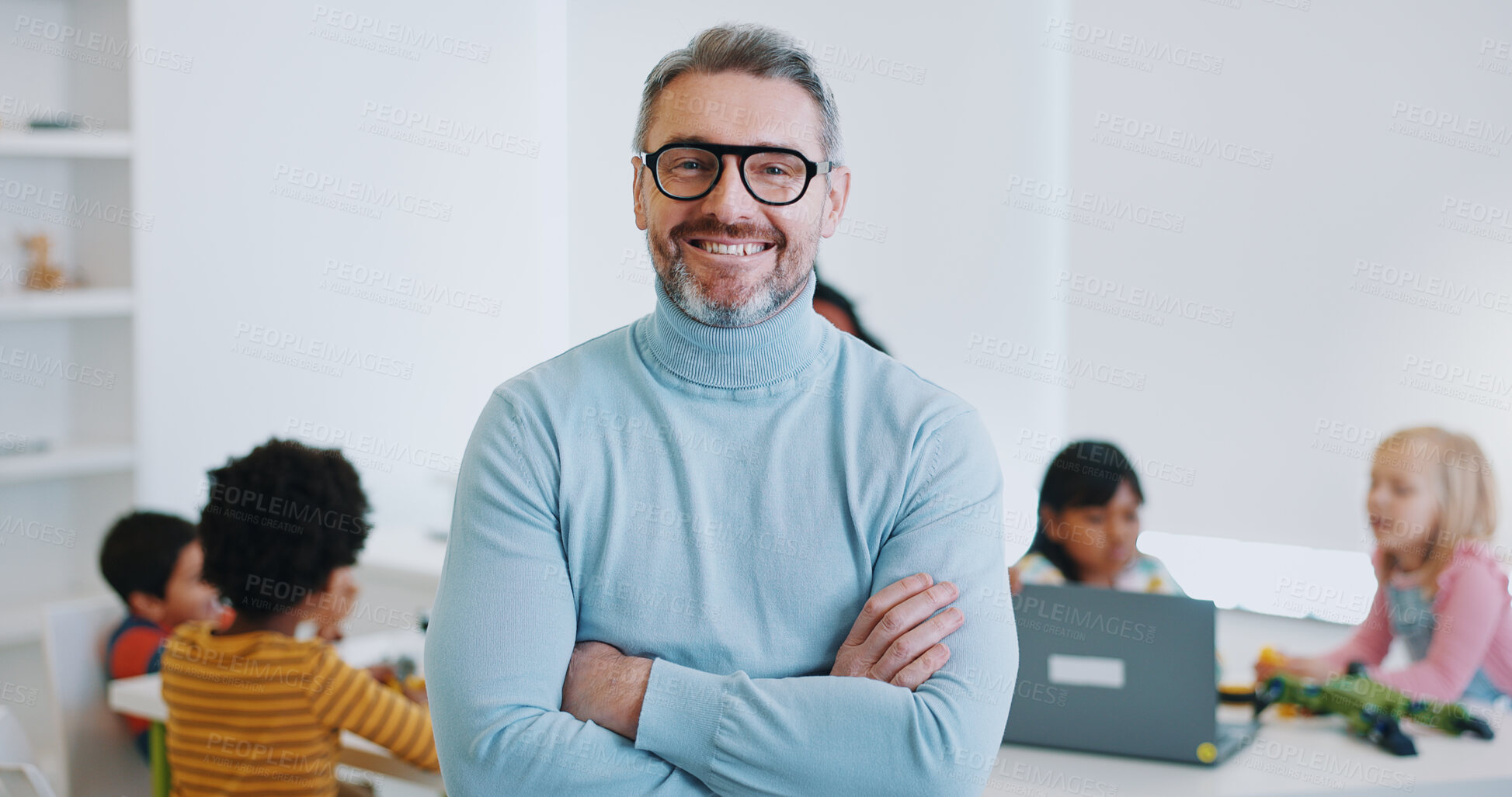 Buy stock photo Portrait, man and teacher with arms crossed, classroom and education with children, students and employee. Face, happy person and educator with kids, learning and teaching in a school and knowledge