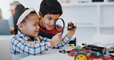 Students magnifying glass and classroom for learning, education and robotics for technology, science and school project. Kindergarten, children or innovation with kids, study and inspection research