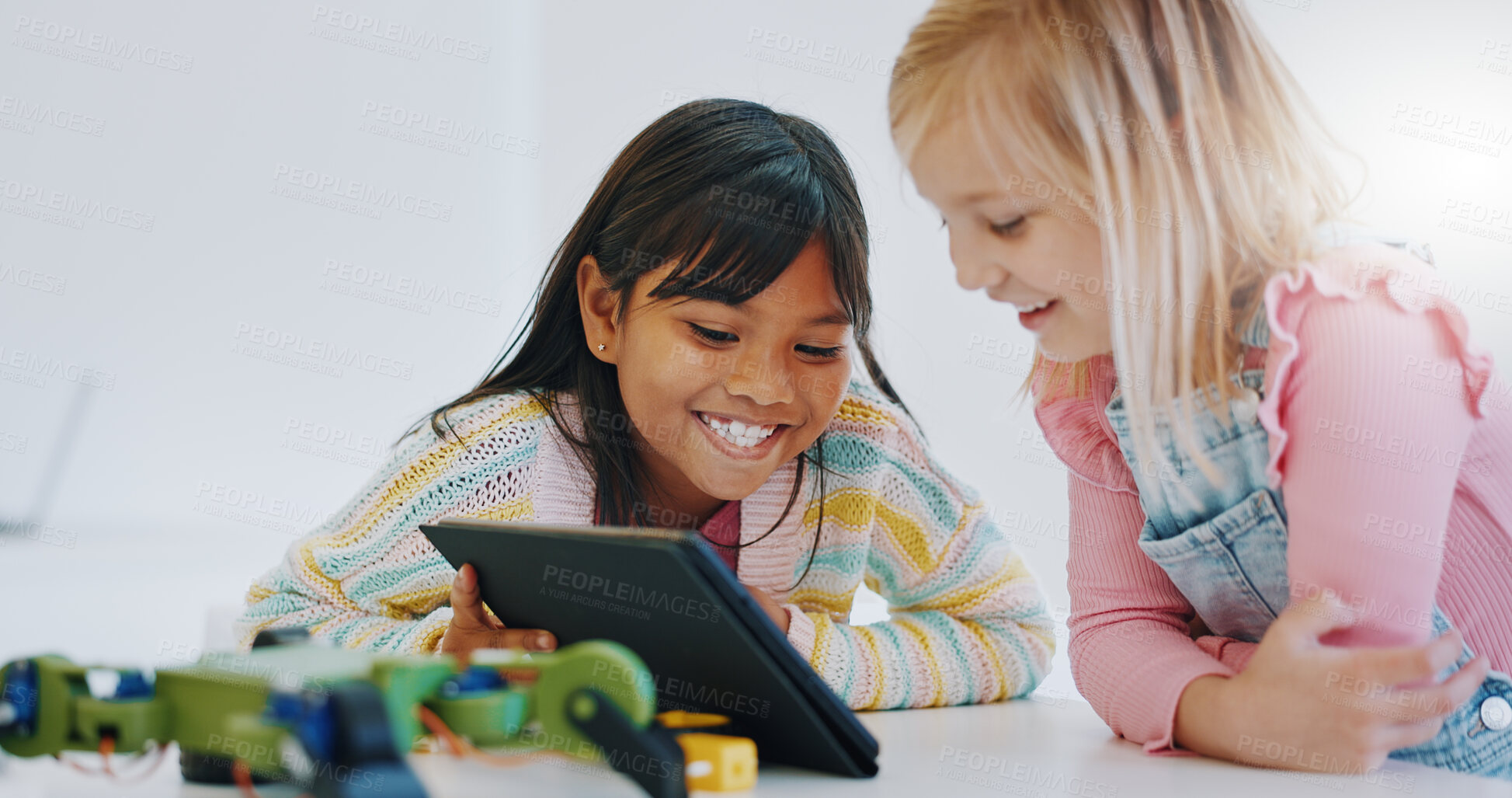 Buy stock photo Learning, children and tablet in robotics classroom for engineering, science and technology education. School, teamwork and girls online together with elearning game, problem solving or research