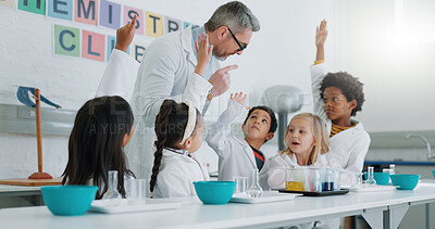 Science, question and students in class with their teacher for learning or to study chemistry. Children, hands raised and education with kids in a laboratory for an experiment of chemical reaction