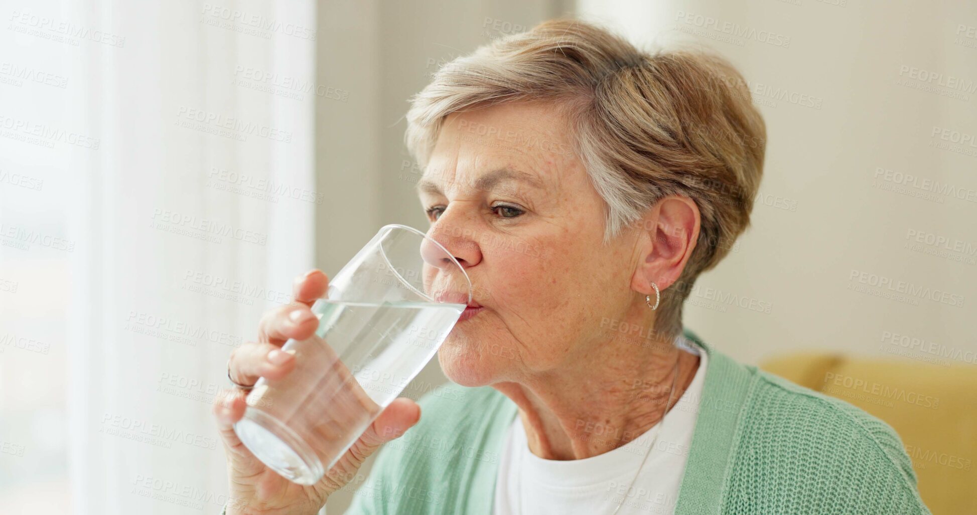 Buy stock photo Health, wellness and senior woman drinking water for hydration and liquid diet detox at home. Weight loss, fresh and calm elderly female person enjoying glass of cold drink in modern retirement house