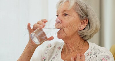 Health, thirsty and mature woman drinking water for hydration and liquid diet detox at home. Wellness, fresh and calm elderly female person enjoying glass of cold drink in modern retirement house.